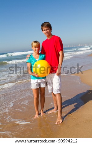 stock photo young teen sister and brother on beach