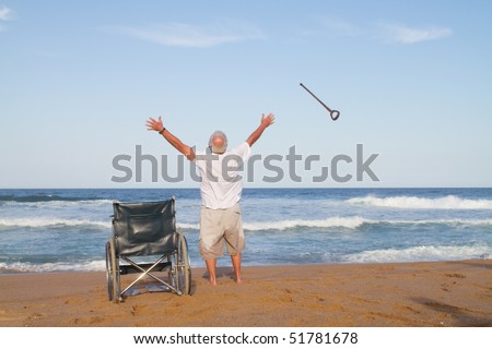 I\'m free. senior man get up from wheelchair and throw away his walking cane