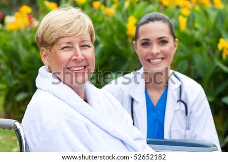 friendly doctor and senior patient outdoors