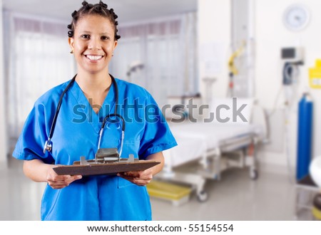 african american nurse with clipboard in hospital