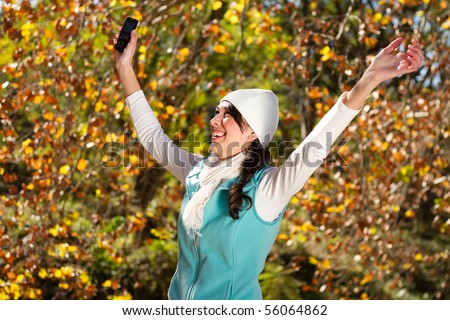 cheerful beautiful woman receive good news via cellphone