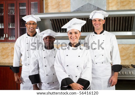 group of professional chefs in hotel kitchen
