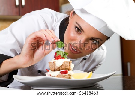 beautiful young chef decorating delicious dessert