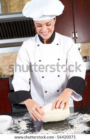 happy young female chef making dough
