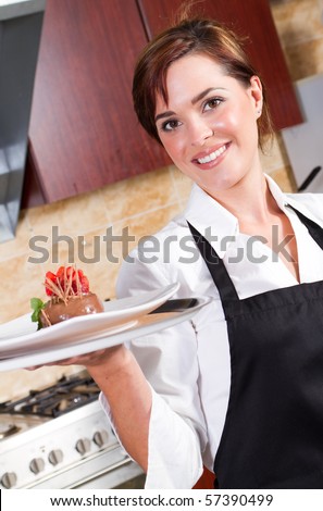 happy waitress holding plate of dessert