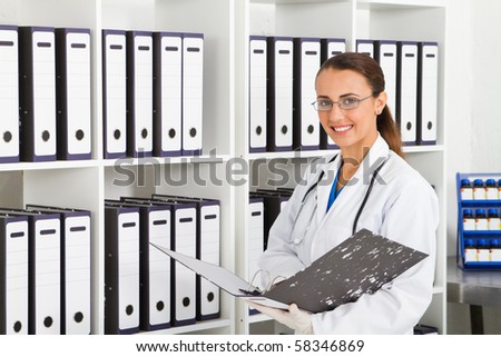 medical intern searching for patient\'s records in office