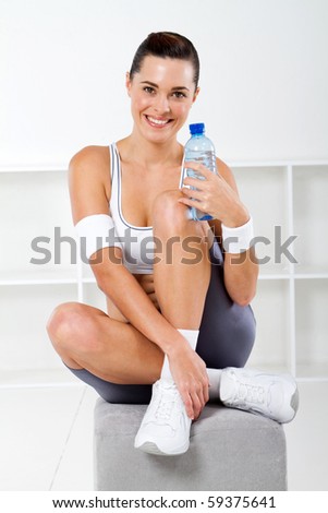 exercise woman drinking water after workout