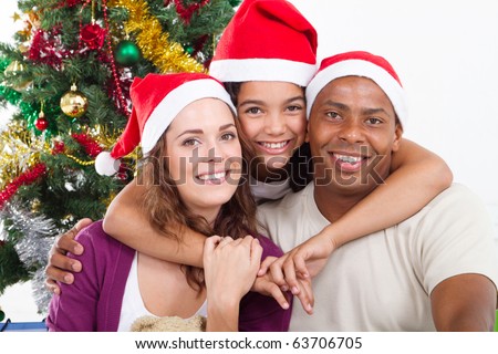 happy family sitting near Christmas tree
