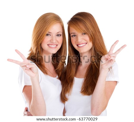stock photo two beautiful young teen girl giving victory hand sign