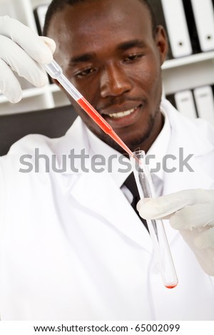 african american male scientist doing experiment
