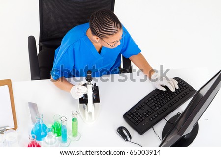 overhead view of african american lab technician worker in lab