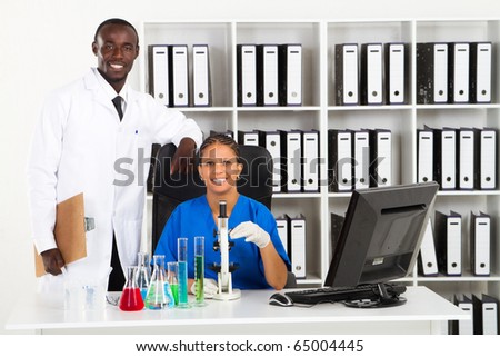 stock photo : two african american scientists in lab