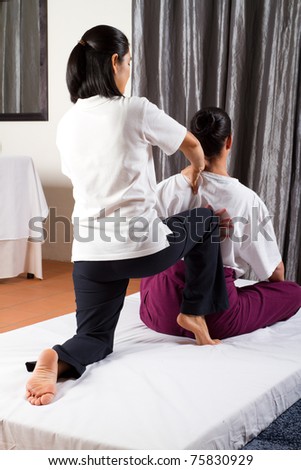 Young woman having Thai massage