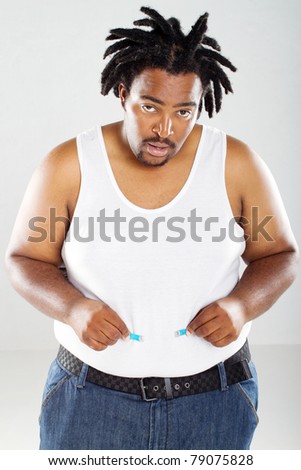 fat african man with measuring tape, the tape is not long enough