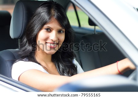 young indian woman driving a car
