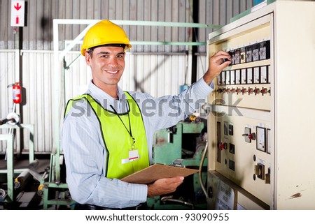 technician setting up industrial machine