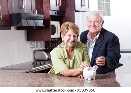 happy senior couple saving for retirement