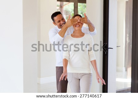 portrait of man surprise his wife with new house