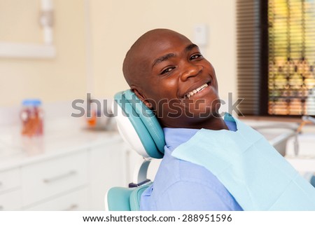 african man visiting dentist for dental checkup