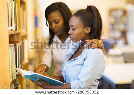 pretty african university students friends studying in library
