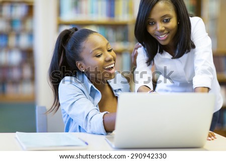 modern african american college students using laptop