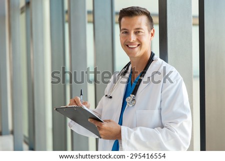 cheerful young healthcare worker in hospital