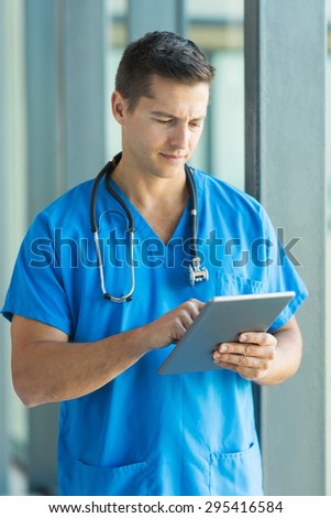 professional doctor using tablet pc in hospital