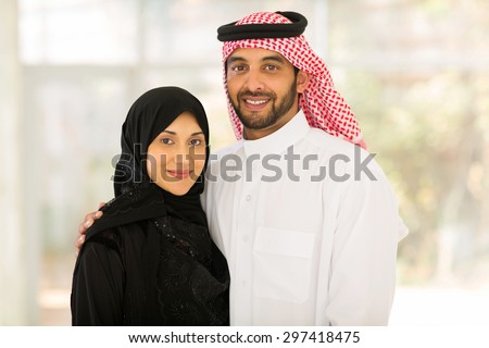 close up portrait of happy middle eastern couple at home