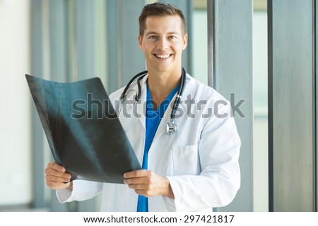 happy health care worker holding ct scan in clinic