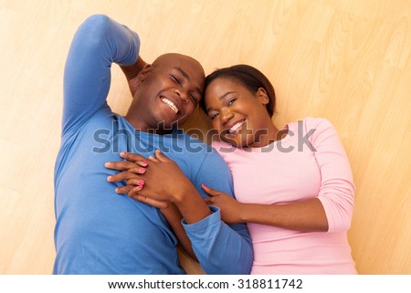 top view of african couple lying on the floor