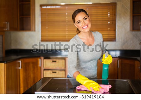 happy young woman doing house chores