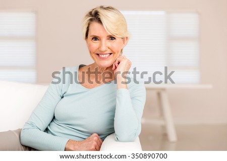 pretty mid age woman relaxing at home