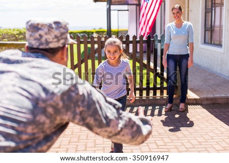 happy young american military family reunion