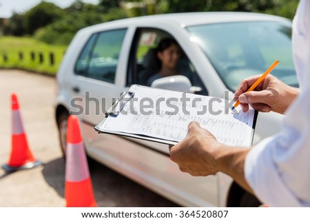 young female learner driver driving test