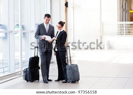 two businesspeople meeting at airport