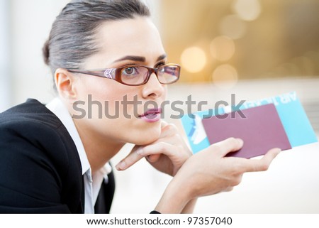 closeup of young businesswoman waiting for her flight in airport