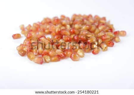 Orange variety of pomegranate and grain on white
