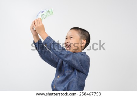 Young boy with happy and smile with korean won bank note on white background