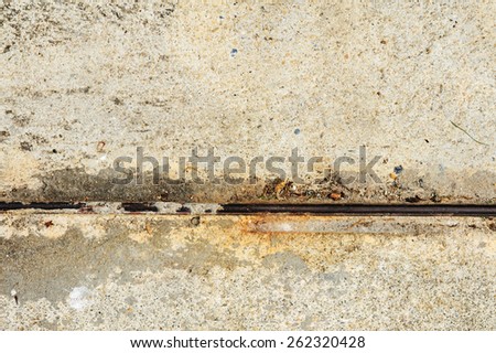 Rust black iron line on old concrete floor
