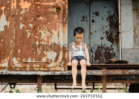 The lonely boy the old train room looking to outside