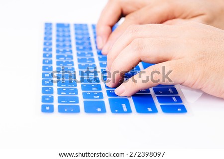 Close up woman finger on blue Thai keyboard cover