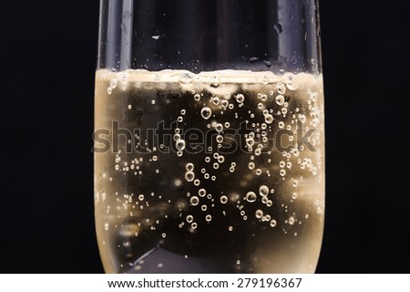 Close up Champagne bubble in glass on black background