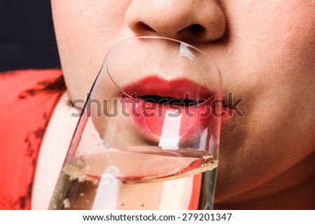 Close up red lip Asian young woman drinking champagne