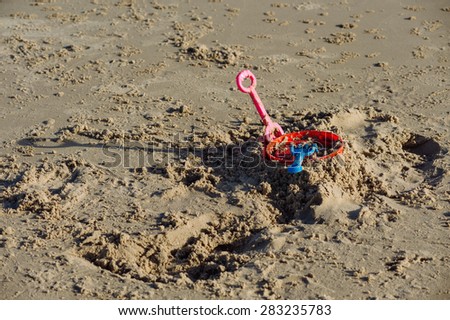 Color of Kid plastic sand toy on sand beach during day light