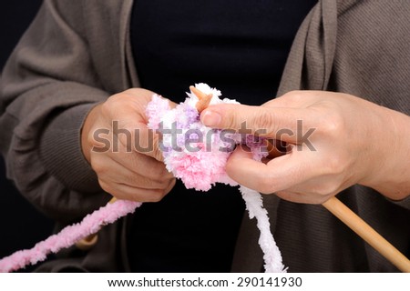 Woman hand use wood knit for wool hand work