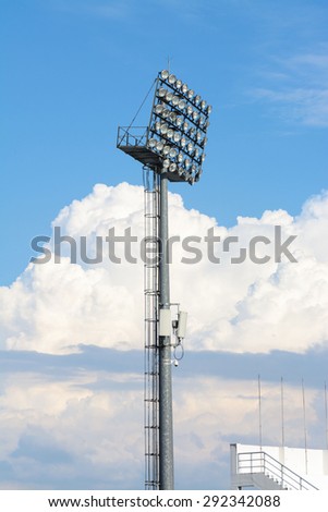 Big and tall stadium spot light under blue sky white cloud