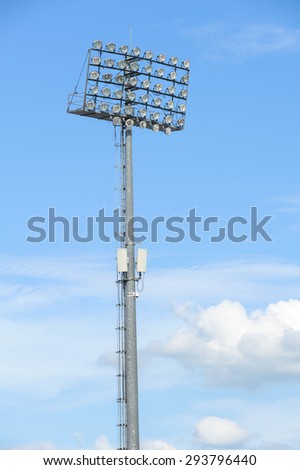Big and tall stadium spot light under blue sky white cloud