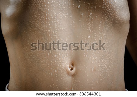 Close up on skin body muscle and sweat drop on young strong Asian boy body after heavy excercise