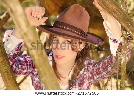 women with Cowboy hat out in the field