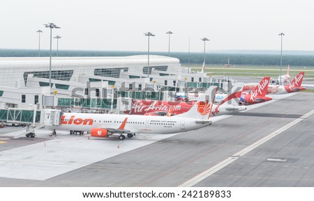 Kuala Lumpur, Malaysia - January 5, 2015. Aircraft of Lion air and Air asia are parking and preparing to flying at Kuala Lumpur International Airport on Jan 5, 2015